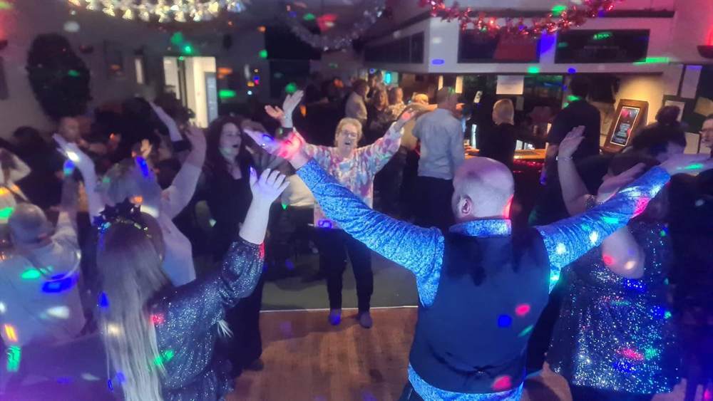 Members dancing at the main bar