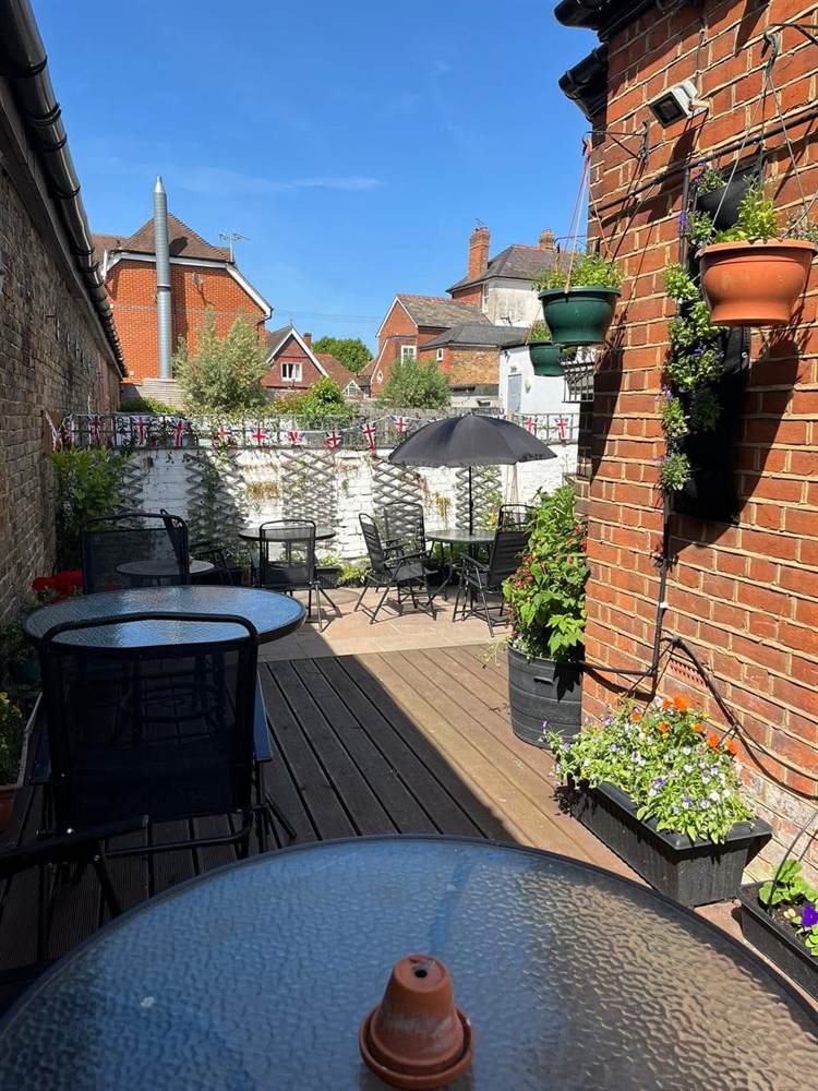 The decking in the Club garden, looking towards the patio